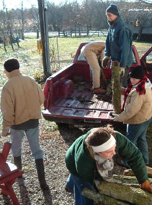 unloading firewood under carport